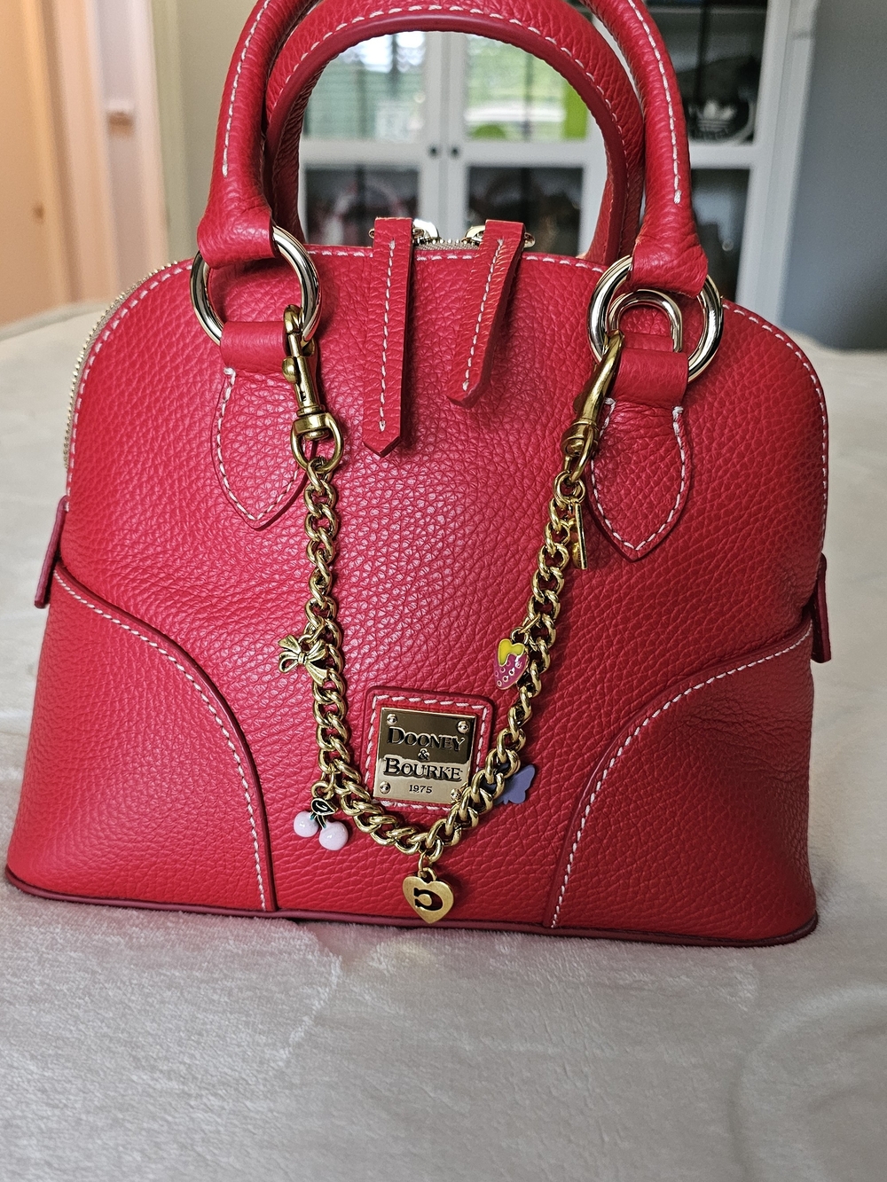 Dooney & Bourke Bright Red Pebbled Leather Satchel with Gold Chain Charm